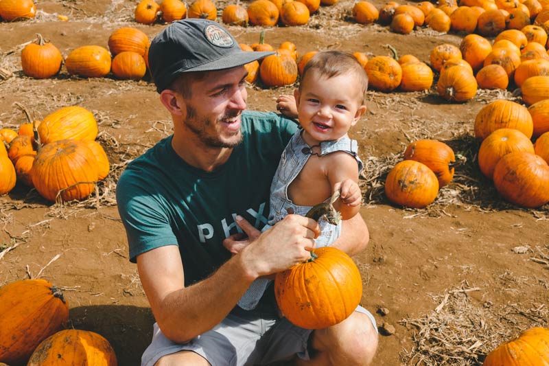 Dad and Kid with pumpkins